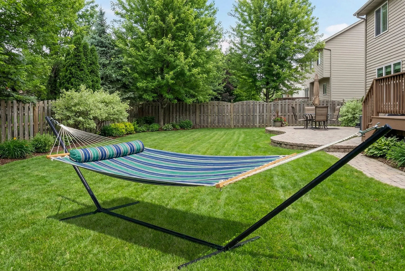 Hammock with stand on a grassy backyard QHD-GBGW+15TBSB