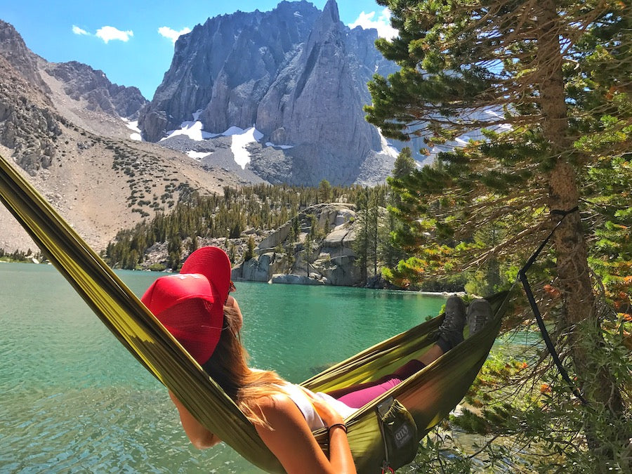 A woman chilling in a hammock in the Rockies