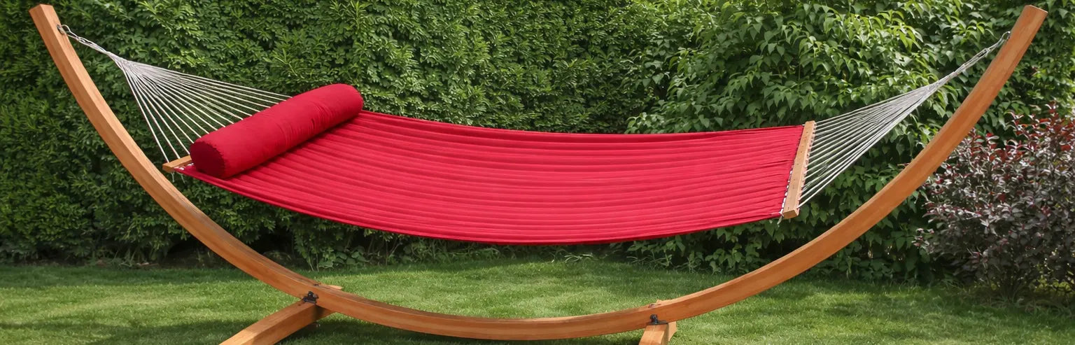 Red quilted olefin double hammock on eucalyptus stand