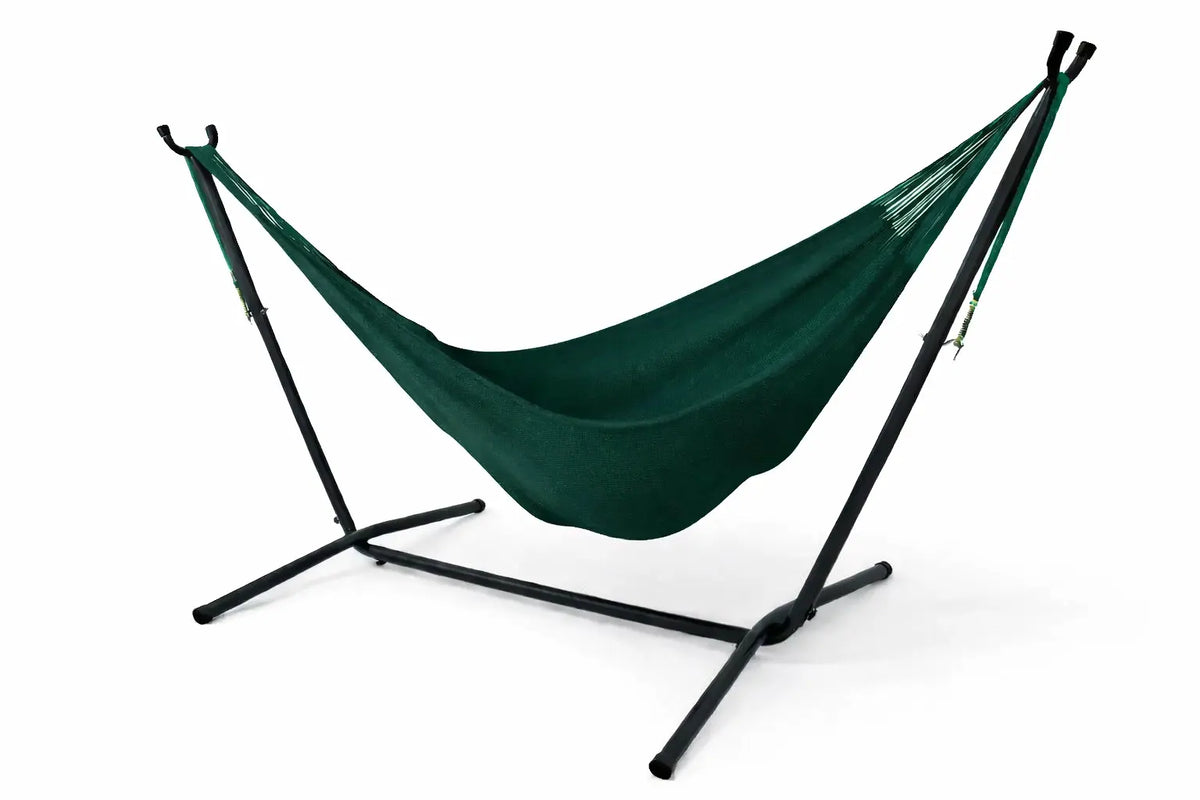 Green hammock with black stand on a white background