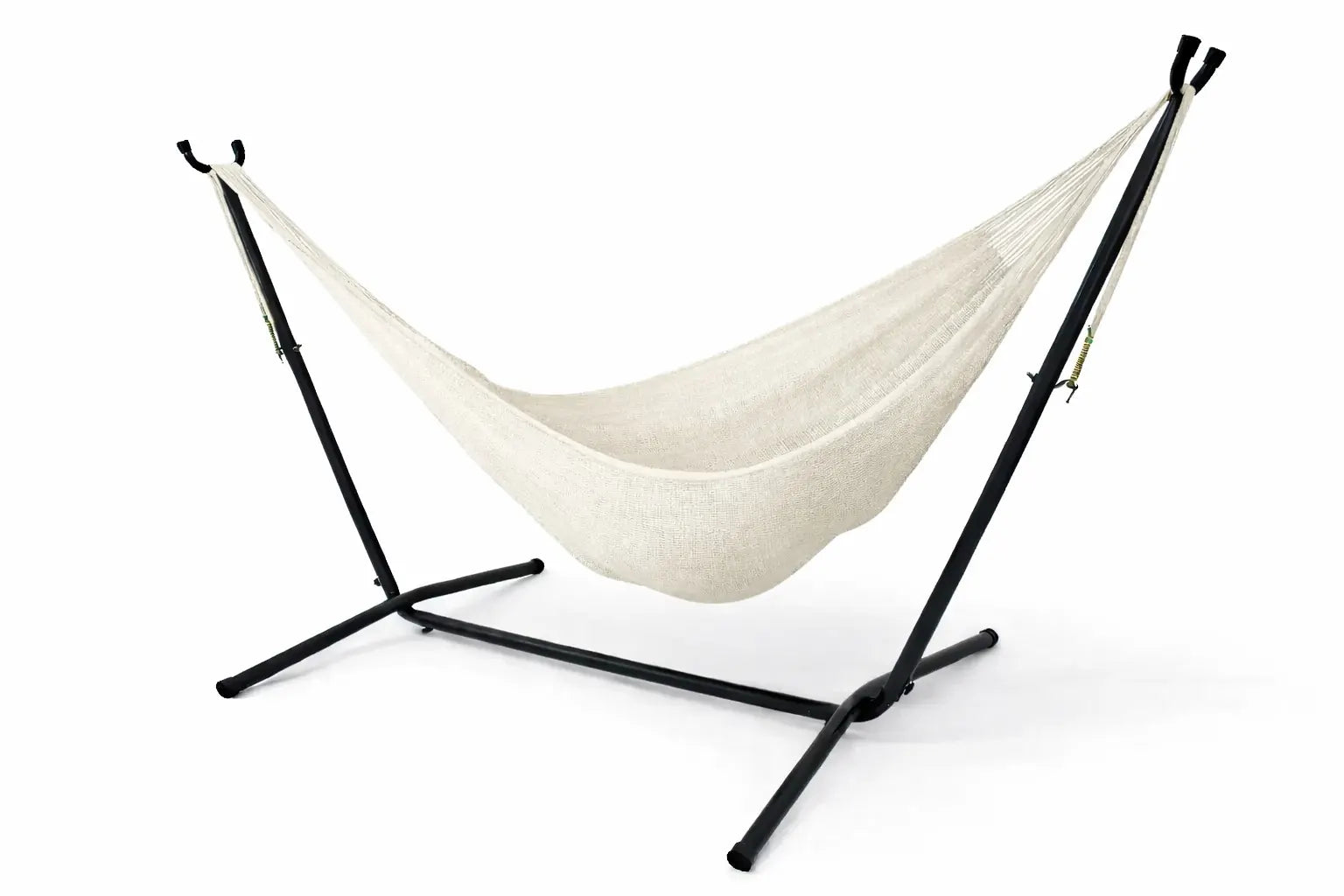 White hammock on a black stand against a white background